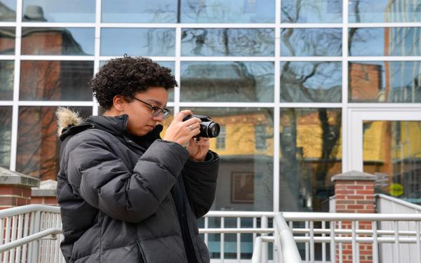 student with camera