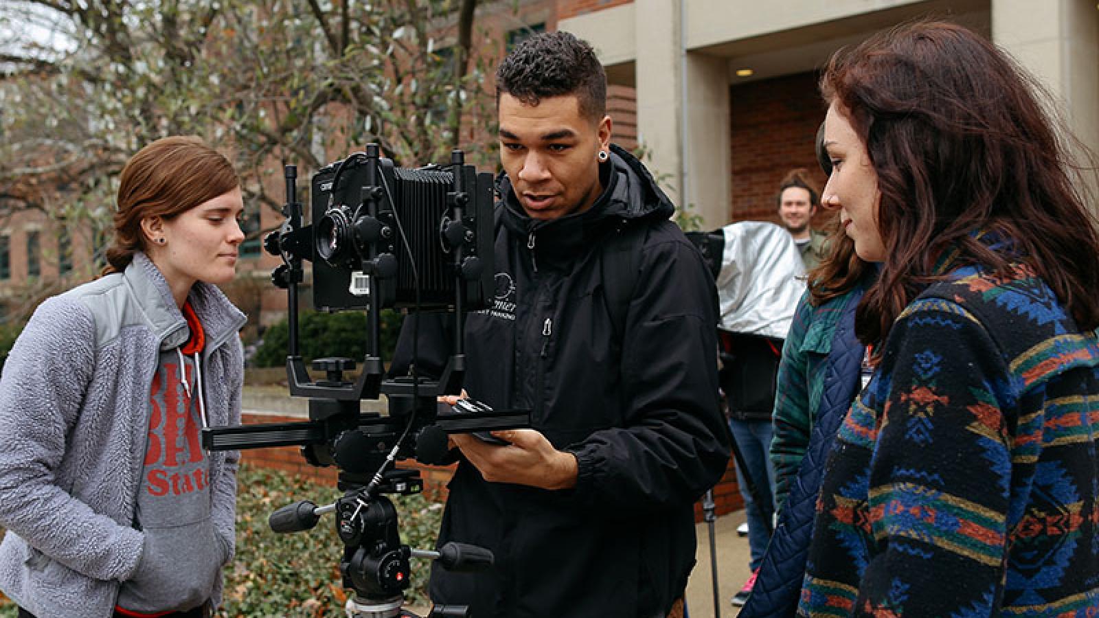 Students working with film camera